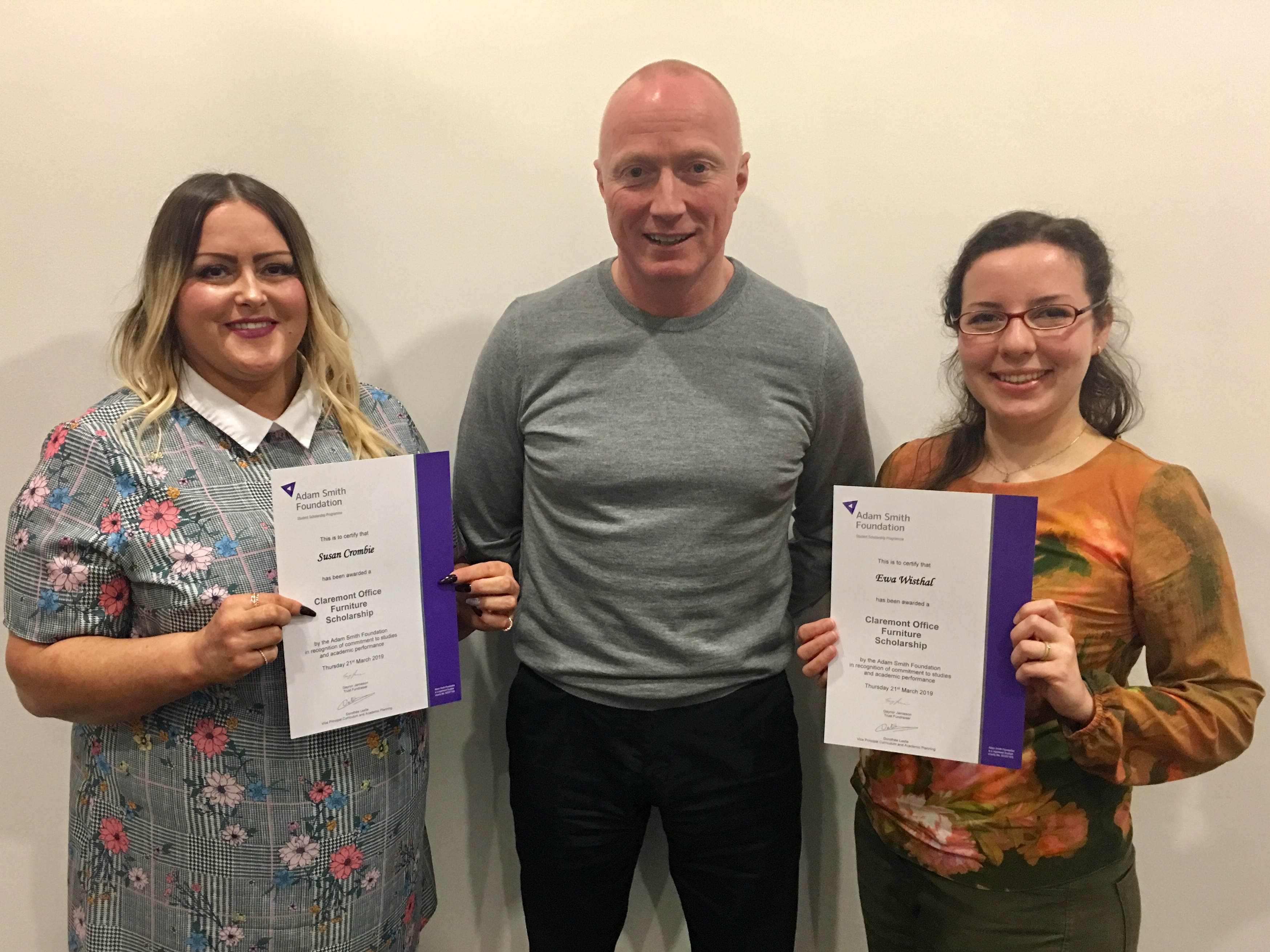 Susan Crombie (left) and Ewa Wisthal (right) are pictured receiving their scholarships from Martin Fellowes, Business Manager for Claremont Office Furniture.