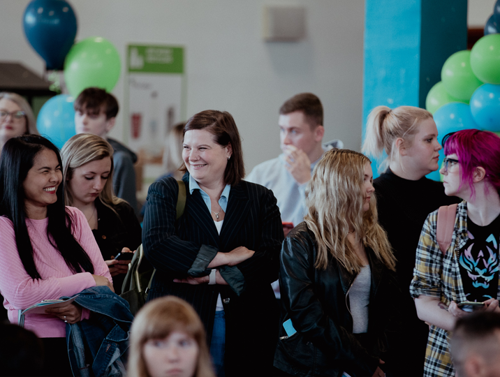 group of students talking to each other 