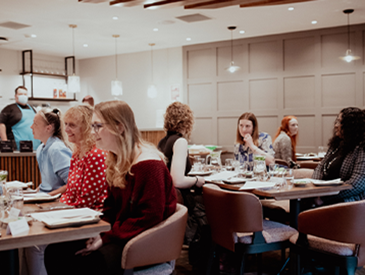 people sitting at tables in fife college training restaurant