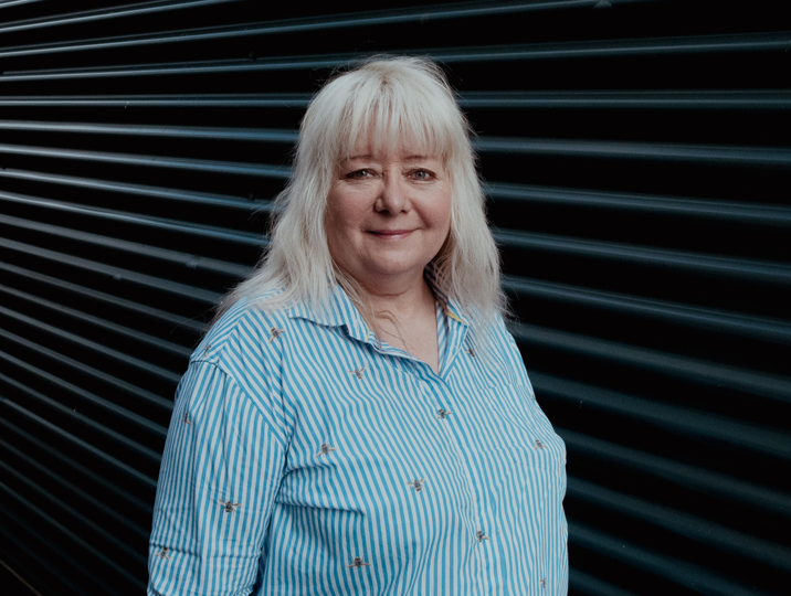 school college partnership staff member tracey smiling at camera