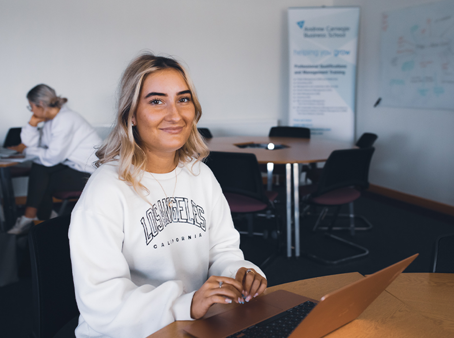 female childcare student smiling at camera