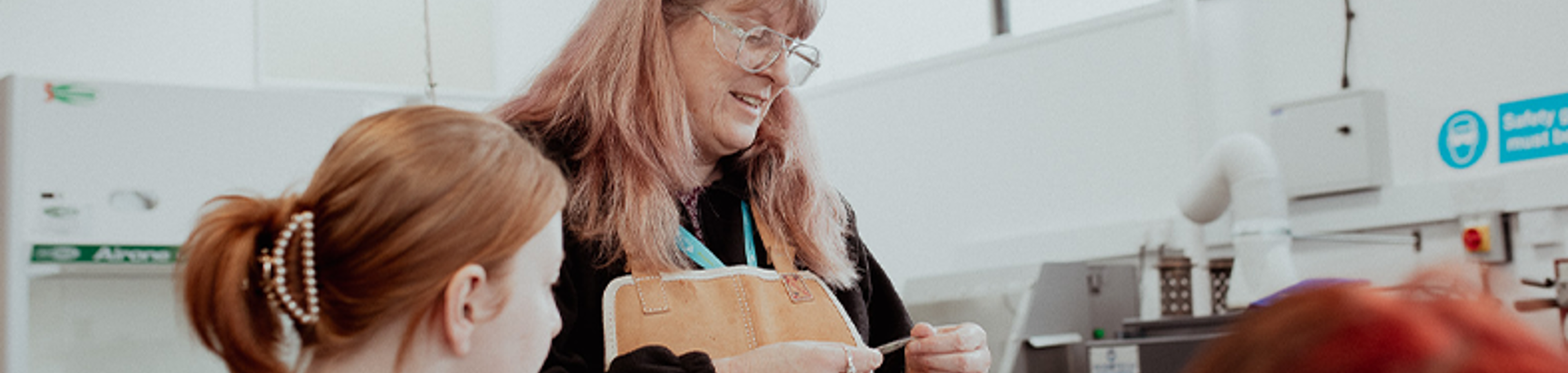 jewellery lecturer demonstrating to students