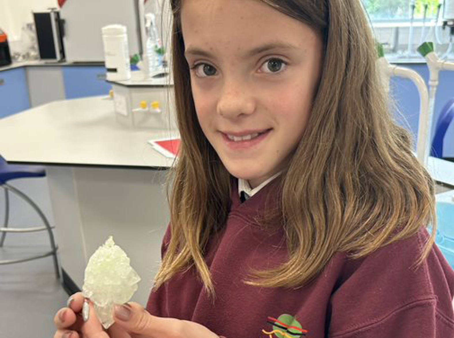 School pupil holding a crystal