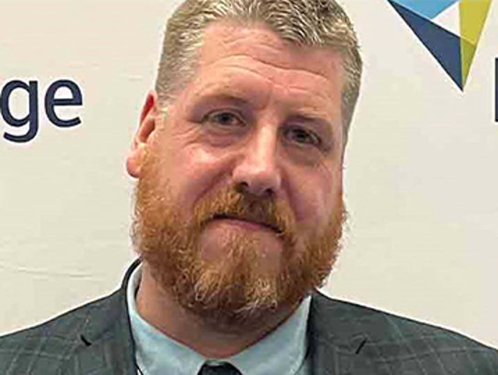 steve smith alumni smiling at camera