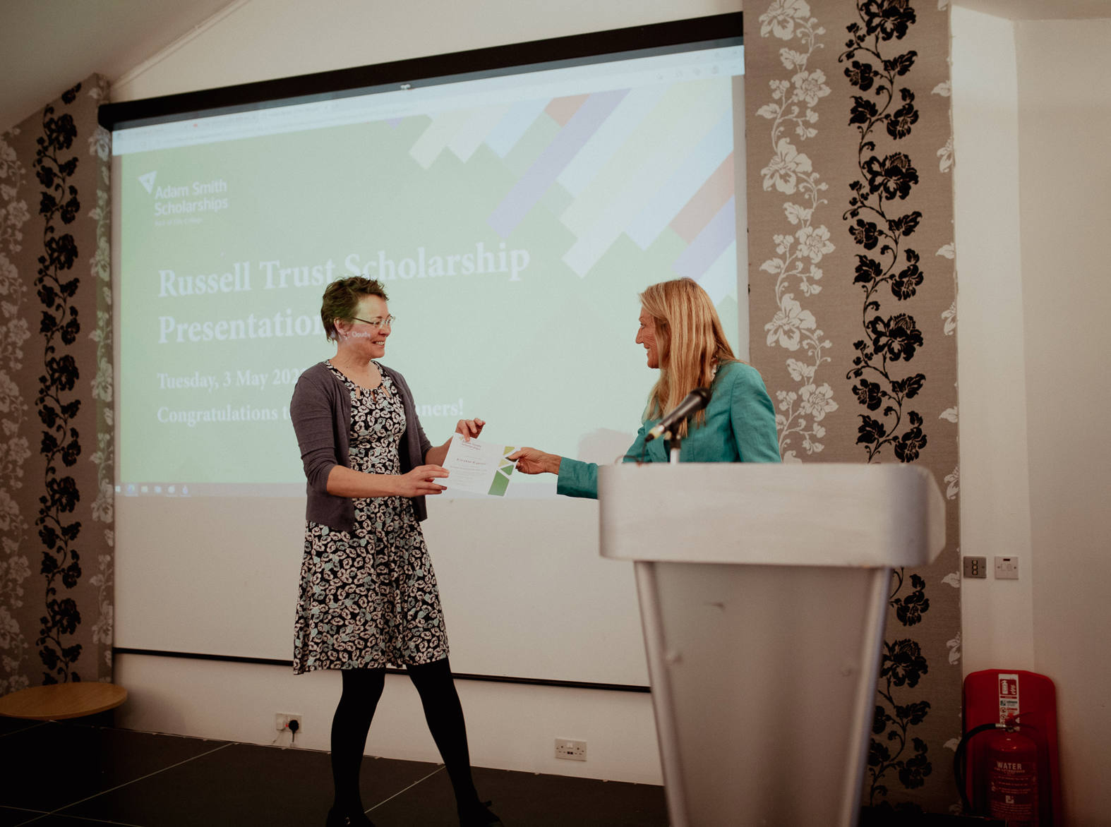 student being awarded certificate on stage