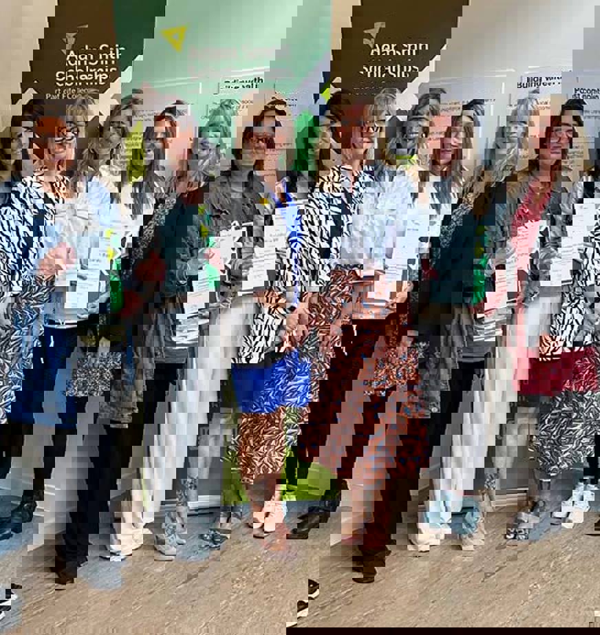 A group of people at a scholarship presentation