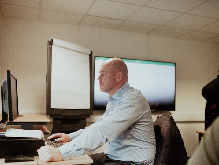 male student working on computer