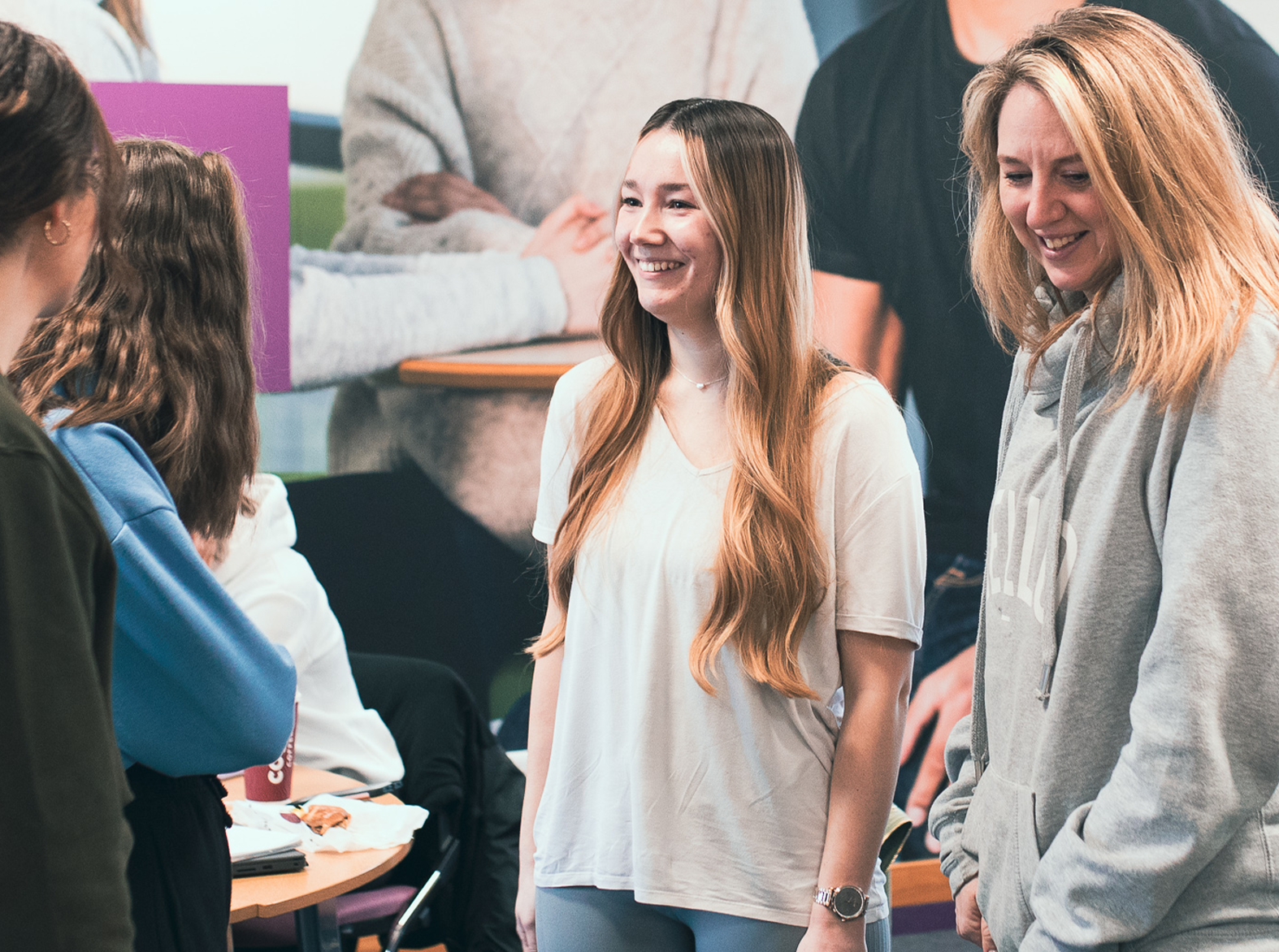 group of students smiling in class