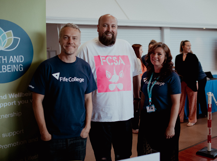 fcsa manager craig with wellbeing team members john and carol smiling at camera