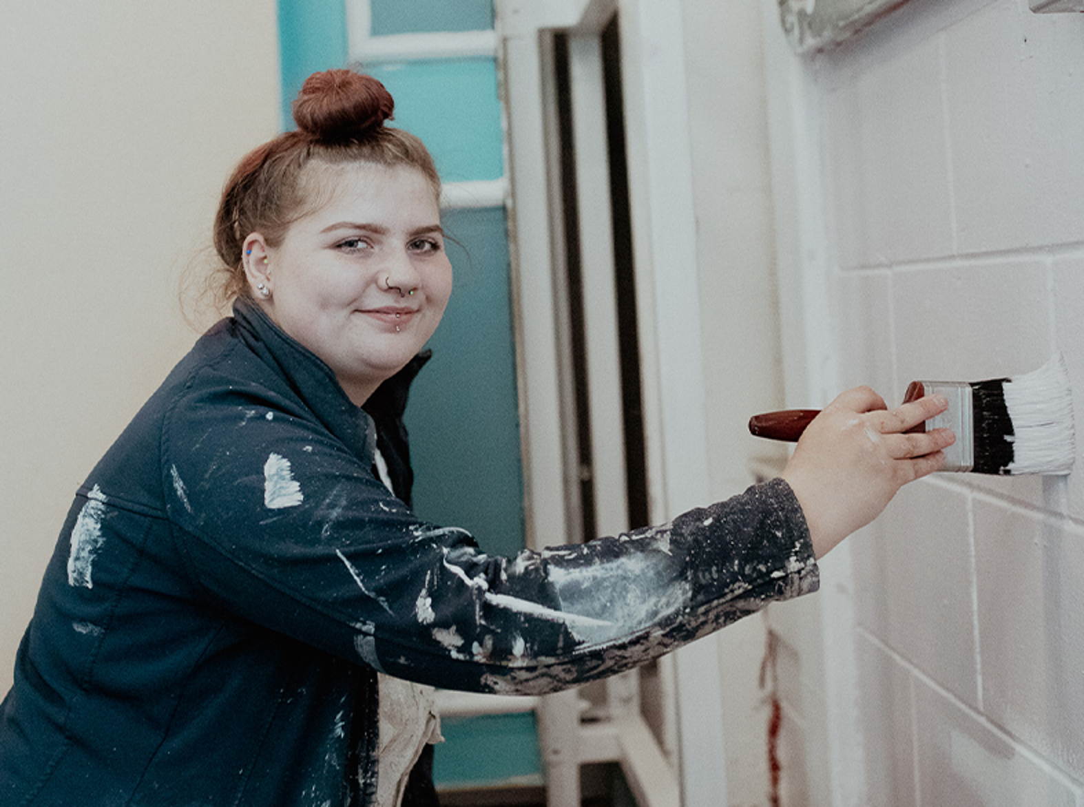female built environment student painting 