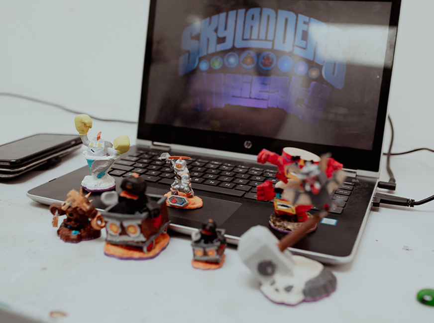 gaming figures in front of computer 
