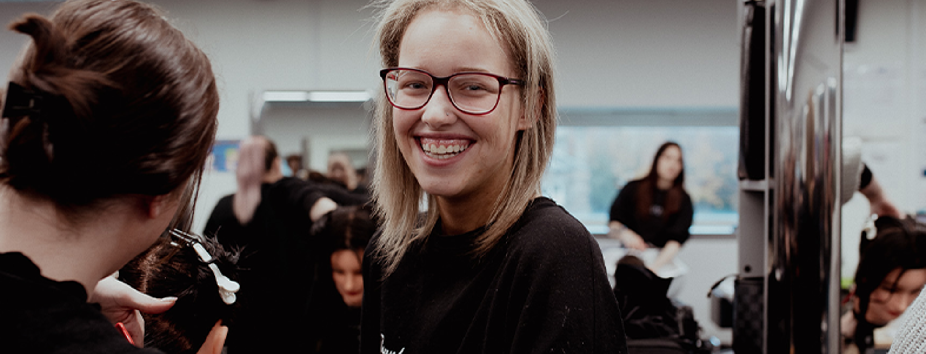 female student smiling at camera