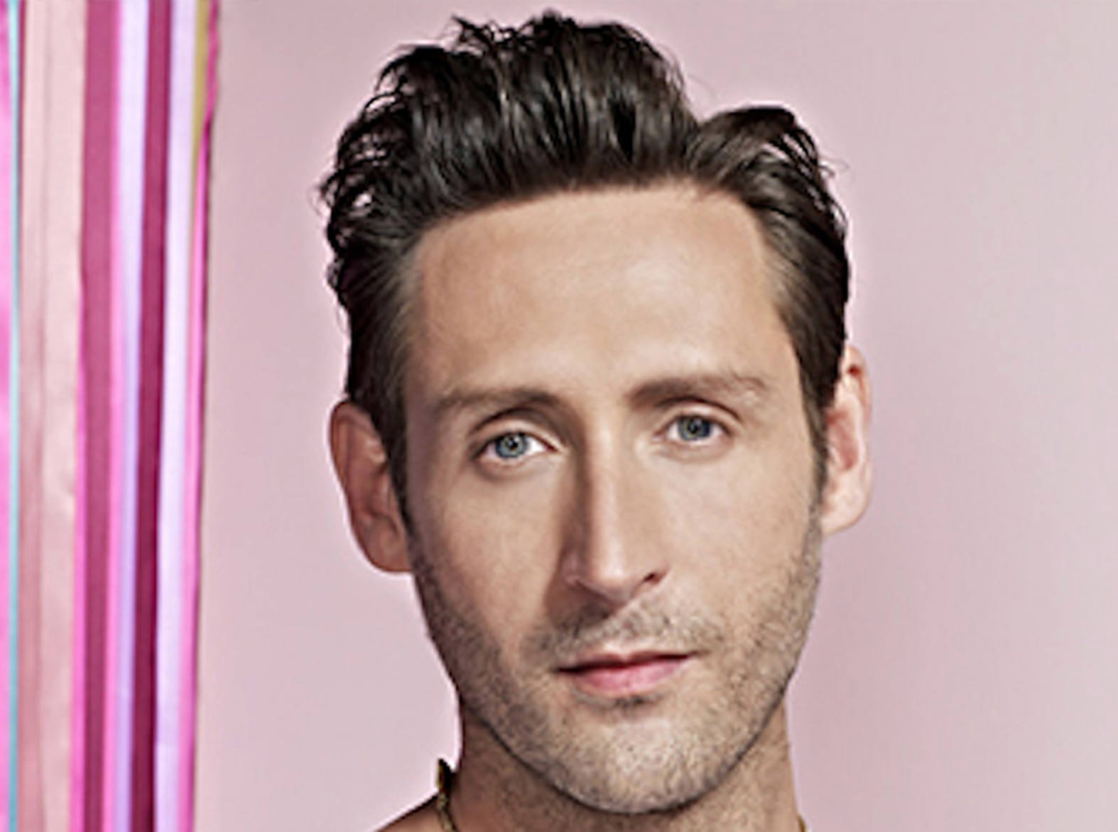 Headshot of a male hair stylist