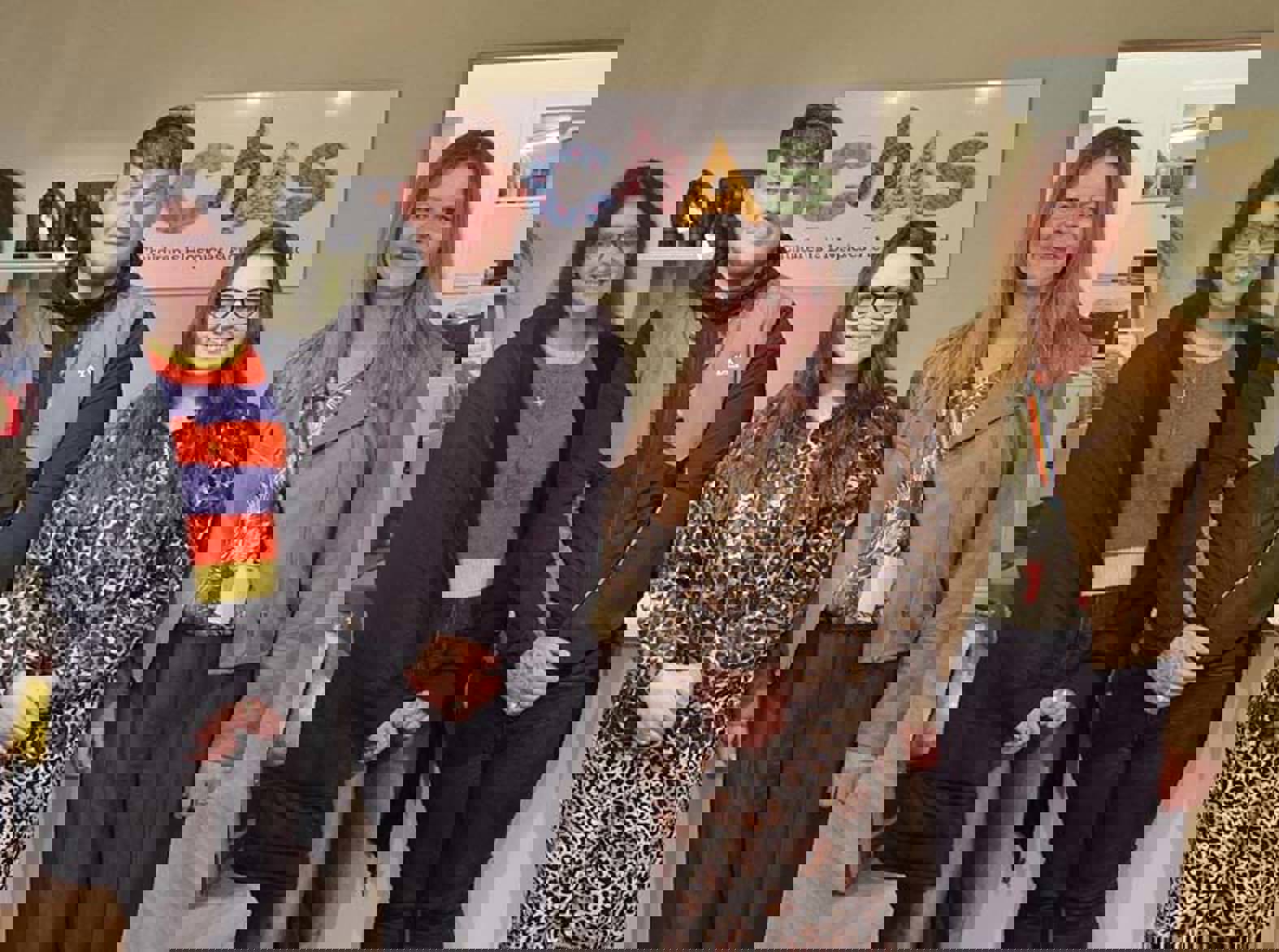 A group of four people standing in a shop