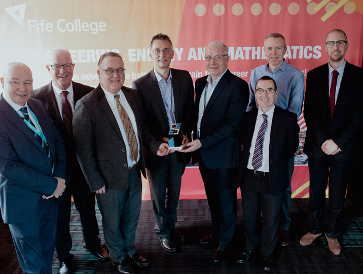 group of business men smiling at camera